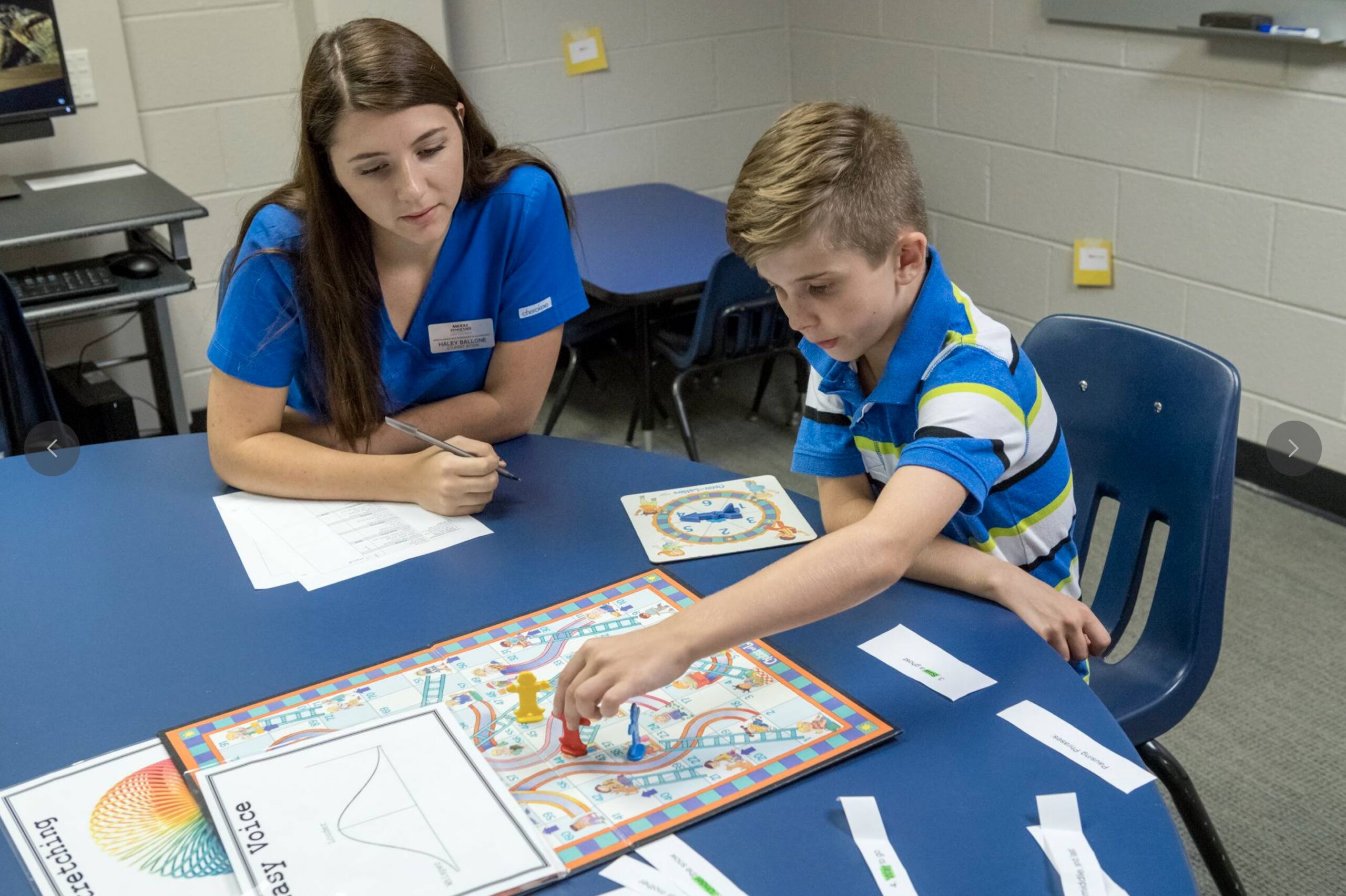 A MTSU SLPA student helps a patient in the clinic