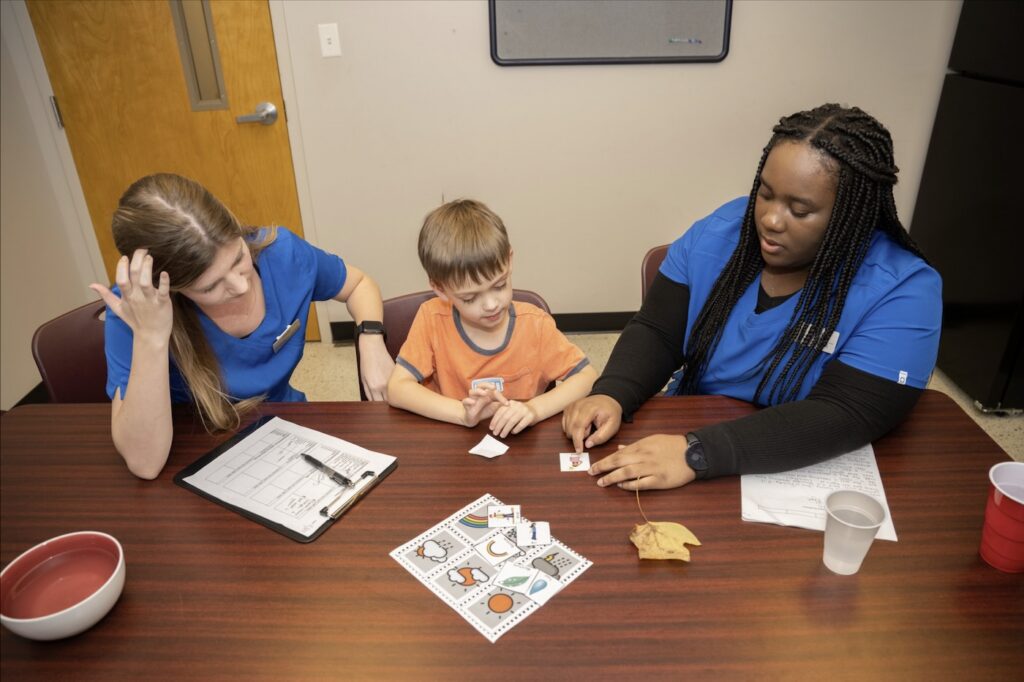 A MTSU Speech-Language, Pathology and Audiology student helps a patient in the on-campus clinic