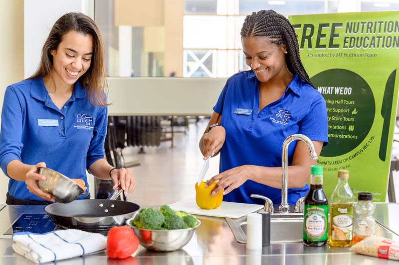 MTSU food and nutrition students in a kitchen preparing food.